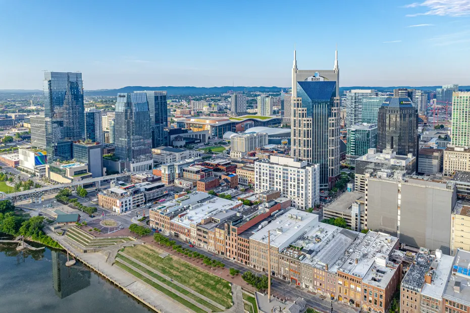 Downtown Nashville from the air, with the river and its riverfront park at the lower left